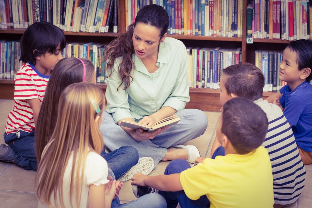 Teacher in an SEL program reading to her small group of students