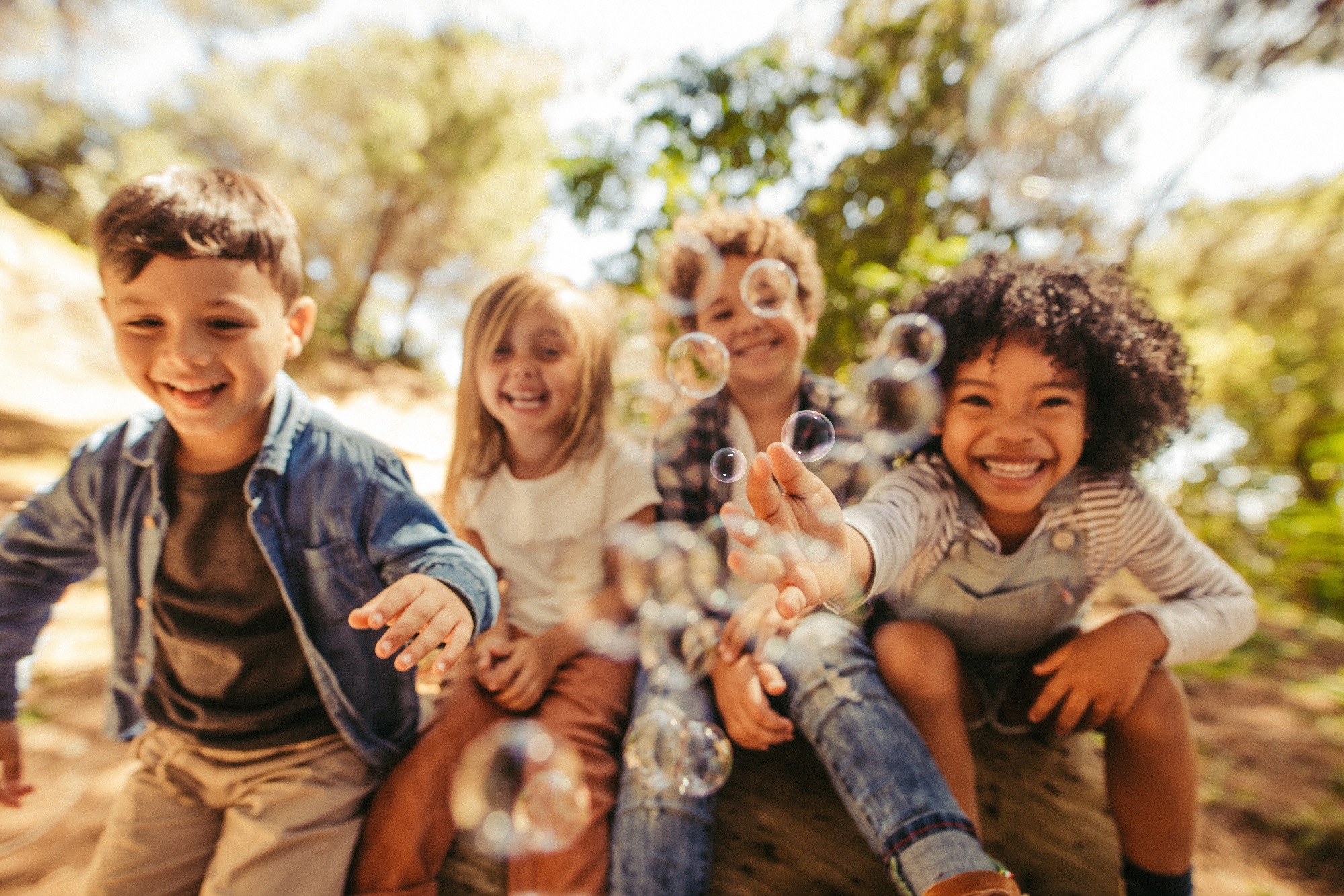 Group of children playing in bubbles