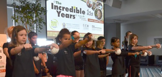 Children present songs to open forum.jpg